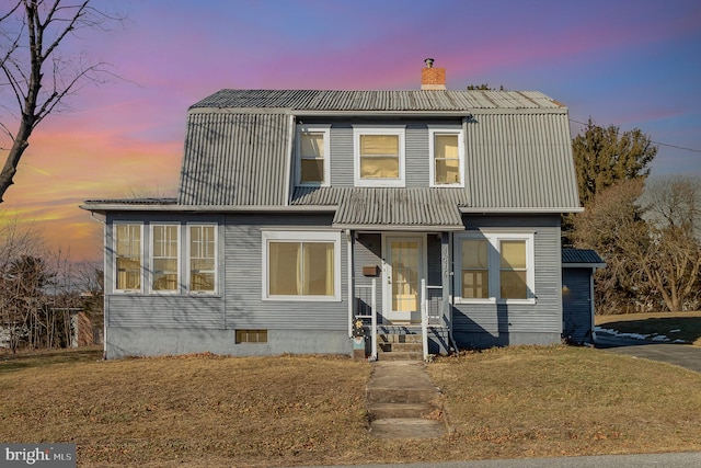 view of front of property with a yard