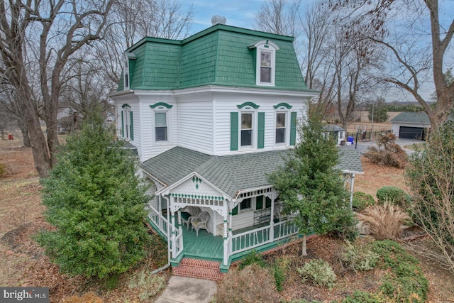 victorian-style house featuring a wooden deck