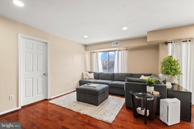 living room featuring dark hardwood / wood-style floors