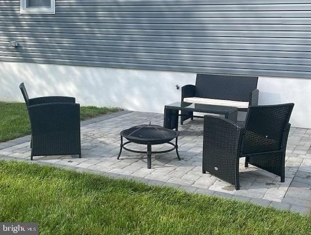 view of patio featuring an outdoor fire pit