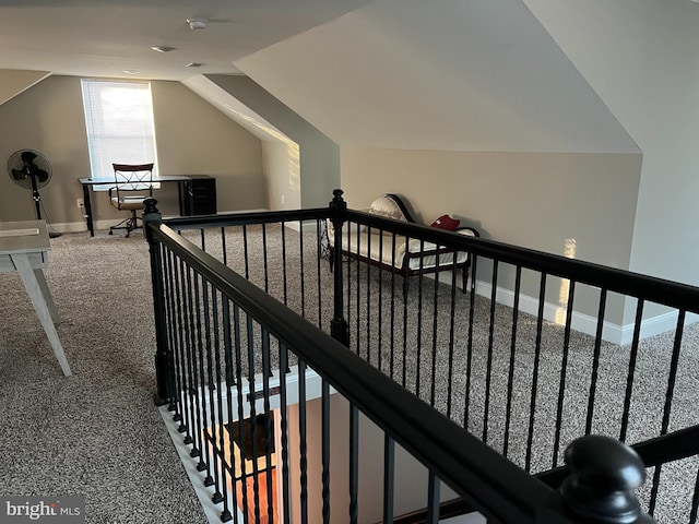 interior space featuring lofted ceiling and carpet floors