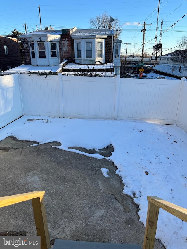 view of yard layered in snow