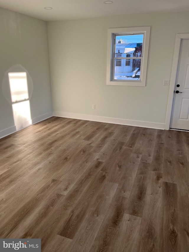 unfurnished room featuring hardwood / wood-style floors