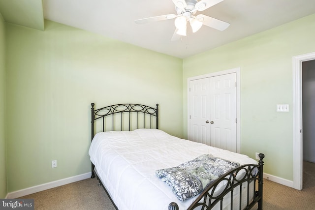 carpeted bedroom with ceiling fan and a closet