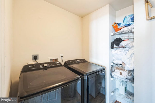 washroom featuring washer and clothes dryer