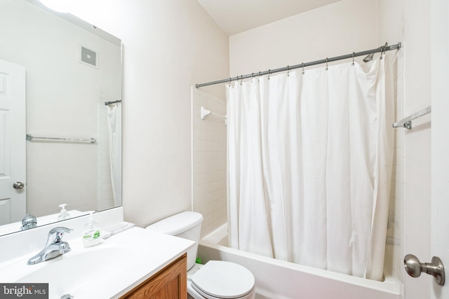 full bathroom featuring vanity, toilet, and shower / bath combination with curtain