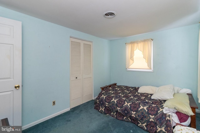 carpeted bedroom with a closet