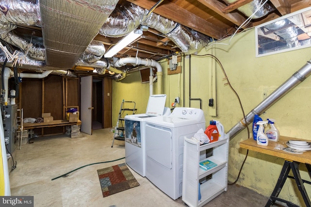 clothes washing area featuring separate washer and dryer