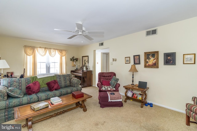 carpeted living room featuring ceiling fan