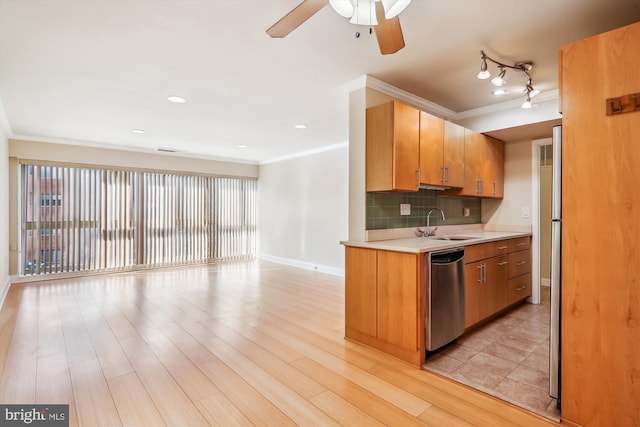 kitchen featuring dishwasher, light hardwood / wood-style flooring, backsplash, ornamental molding, and sink