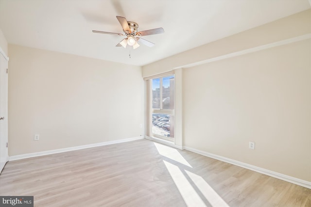 empty room featuring light hardwood / wood-style floors and ceiling fan