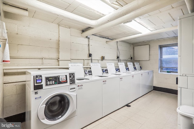 washroom with separate washer and dryer