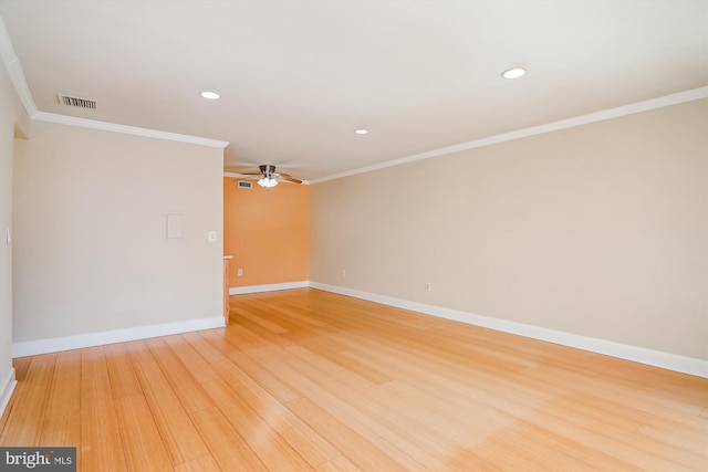 empty room with wood-type flooring, ornamental molding, and ceiling fan