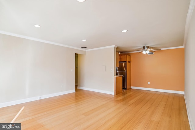 unfurnished living room with light wood-type flooring, ceiling fan, and crown molding