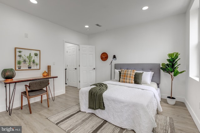 bedroom with light wood-type flooring