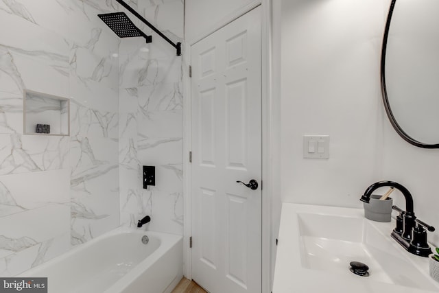 bathroom featuring sink and tiled shower / bath combo