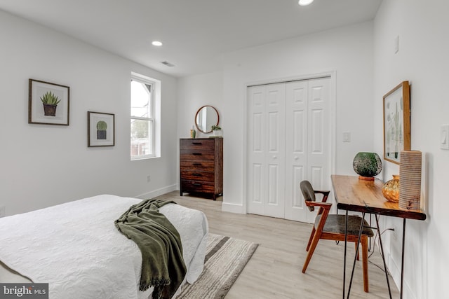 bedroom with a closet and light wood-type flooring