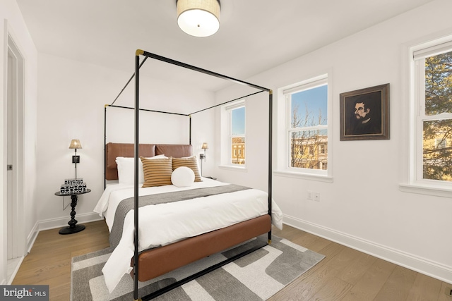 bedroom with wood-type flooring