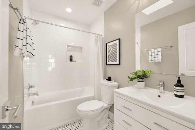 full bathroom featuring vanity, toilet, and shower / tub combo with curtain