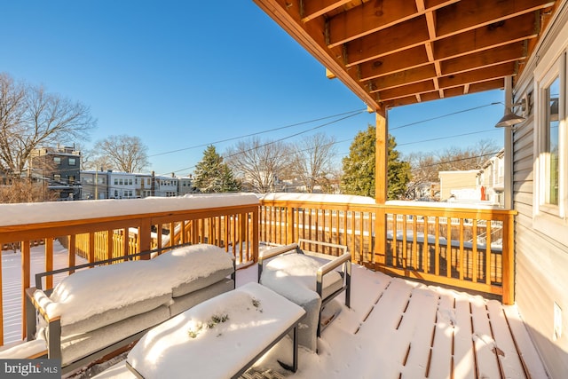 view of snow covered deck