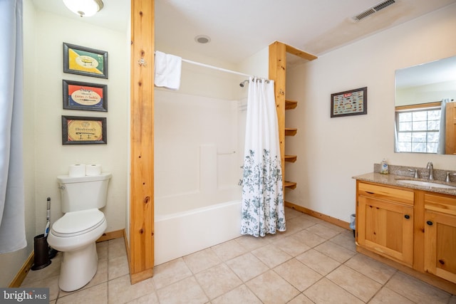 full bathroom with shower / bath combo with shower curtain, tile patterned floors, toilet, and vanity