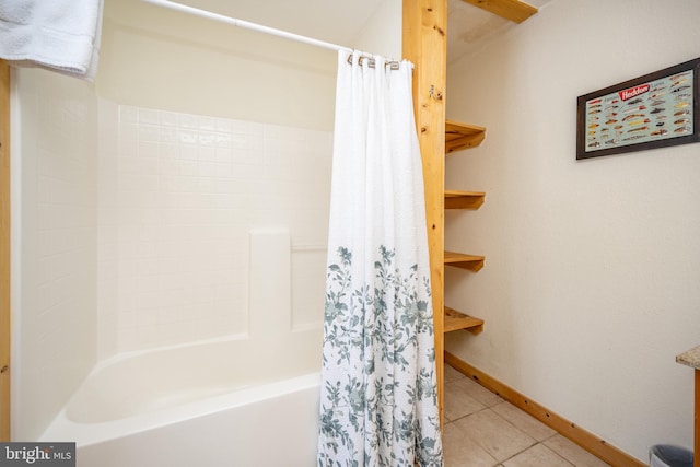 bathroom with tile patterned floors and shower / tub combo