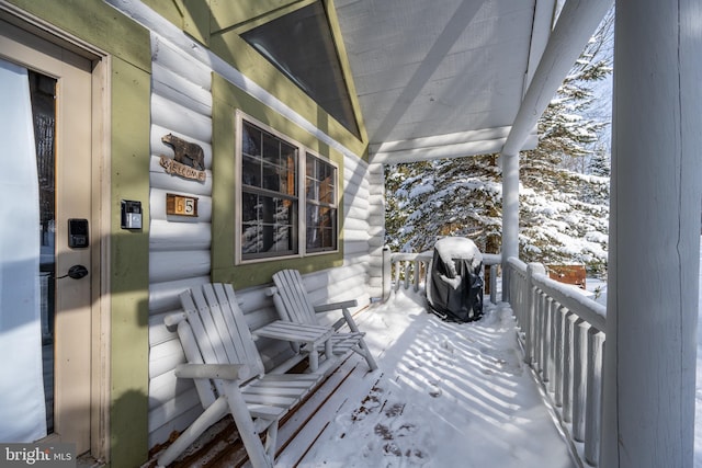 view of snow covered deck