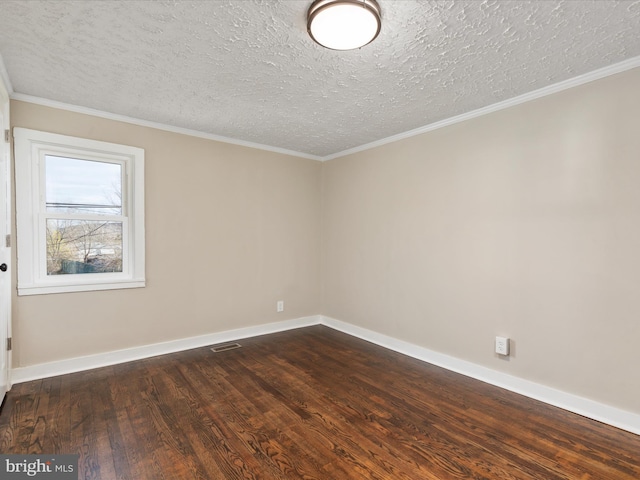 spare room with crown molding, a textured ceiling, and dark hardwood / wood-style flooring