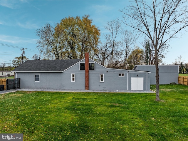 back of house with a yard