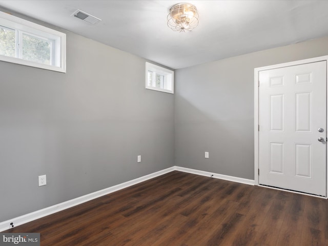 basement with dark wood-type flooring