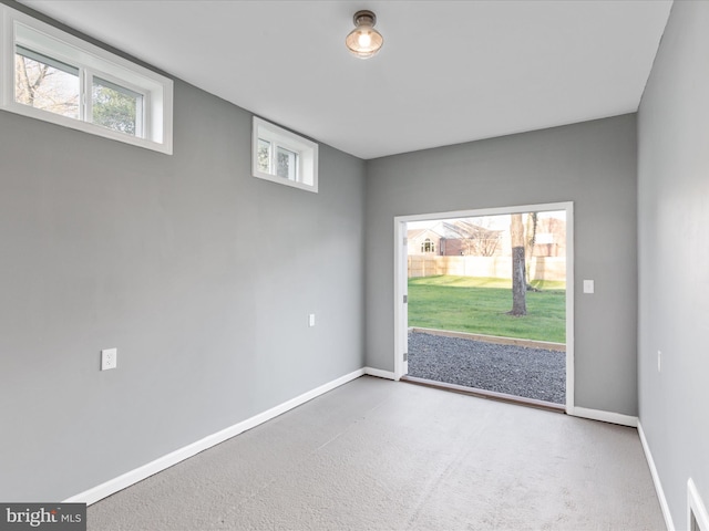 unfurnished room featuring carpet