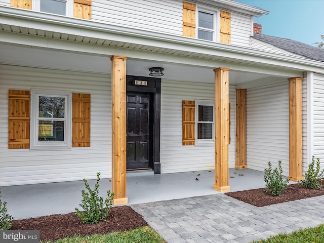 entrance to property with covered porch