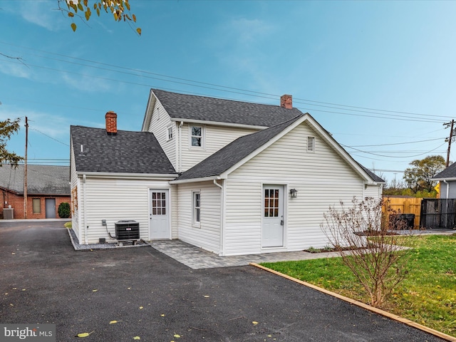 back of house with a patio and central air condition unit