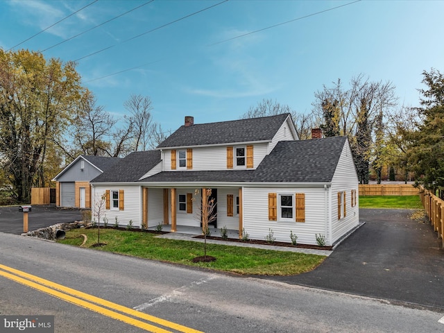 view of front of home featuring a garage and a front yard