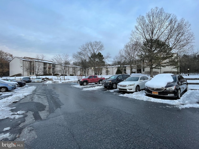 view of snow covered parking