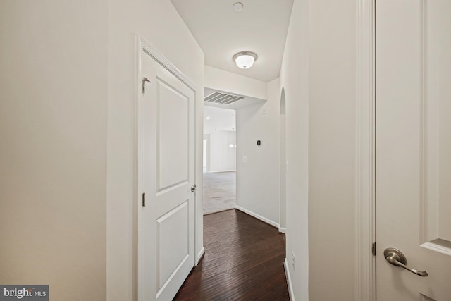 hall with dark hardwood / wood-style floors