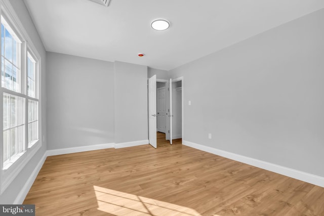 spare room featuring light wood-type flooring