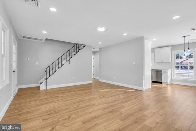 unfurnished living room with light wood-type flooring