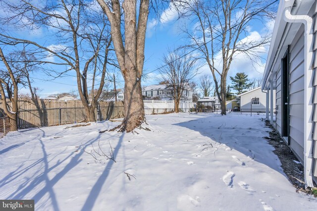 view of yard layered in snow