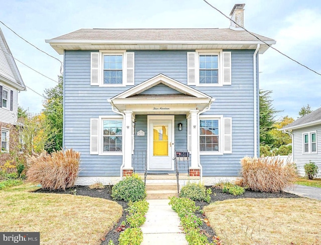 view of front of property with a front lawn