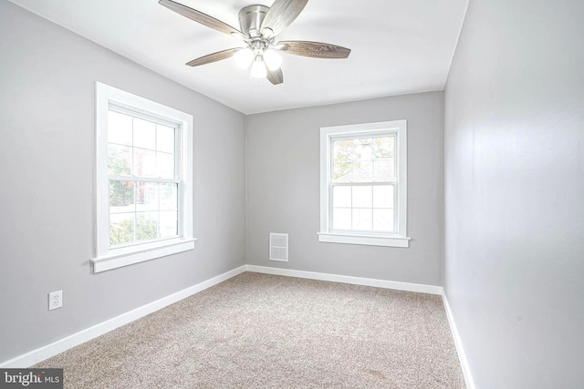 carpeted empty room with ceiling fan