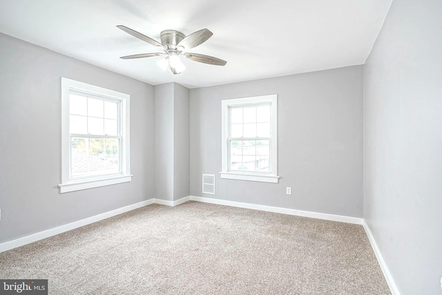 carpeted empty room with ceiling fan