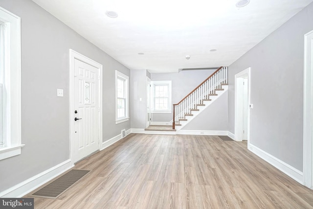 entrance foyer with light hardwood / wood-style flooring