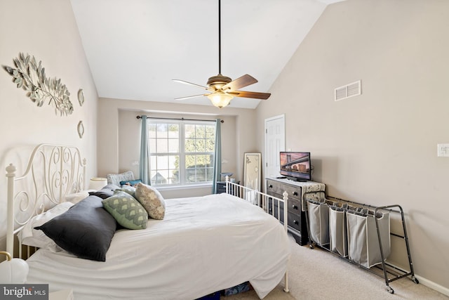 carpeted bedroom with ceiling fan and lofted ceiling