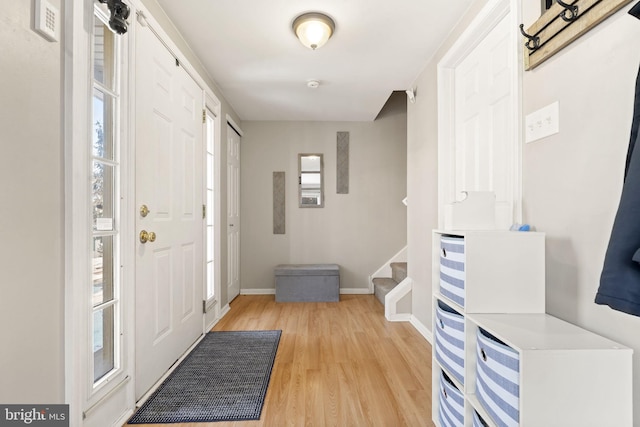 foyer entrance featuring a healthy amount of sunlight and light hardwood / wood-style flooring