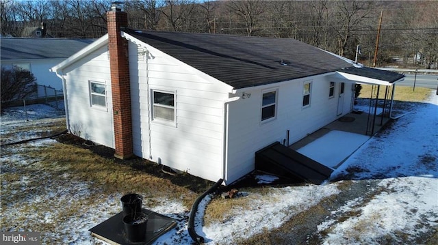 view of snow covered property