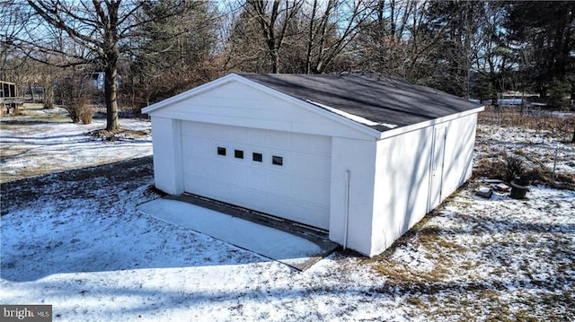 view of snow covered garage