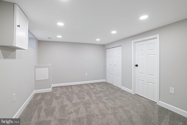 basement with light colored carpet