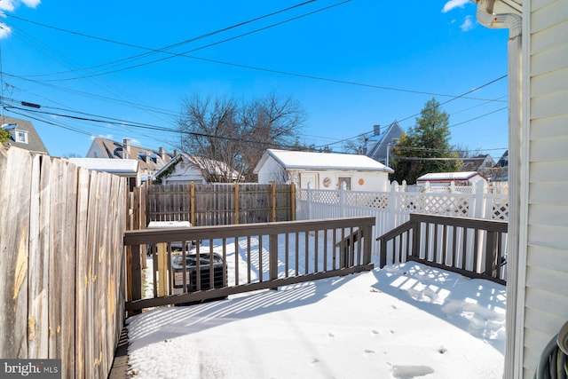 view of snow covered deck