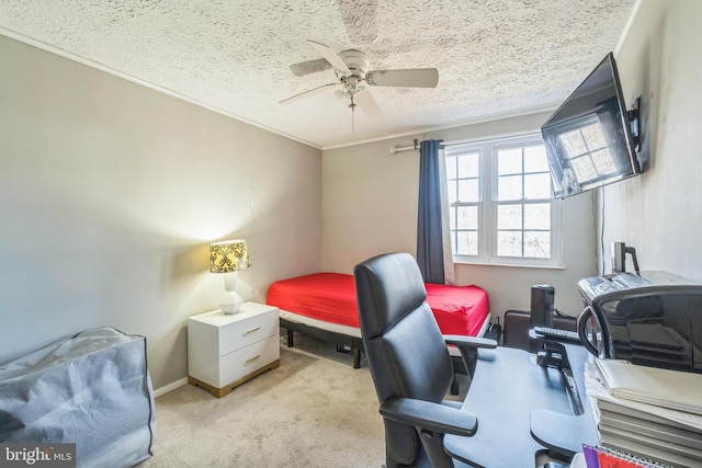 carpeted bedroom with a textured ceiling and ceiling fan